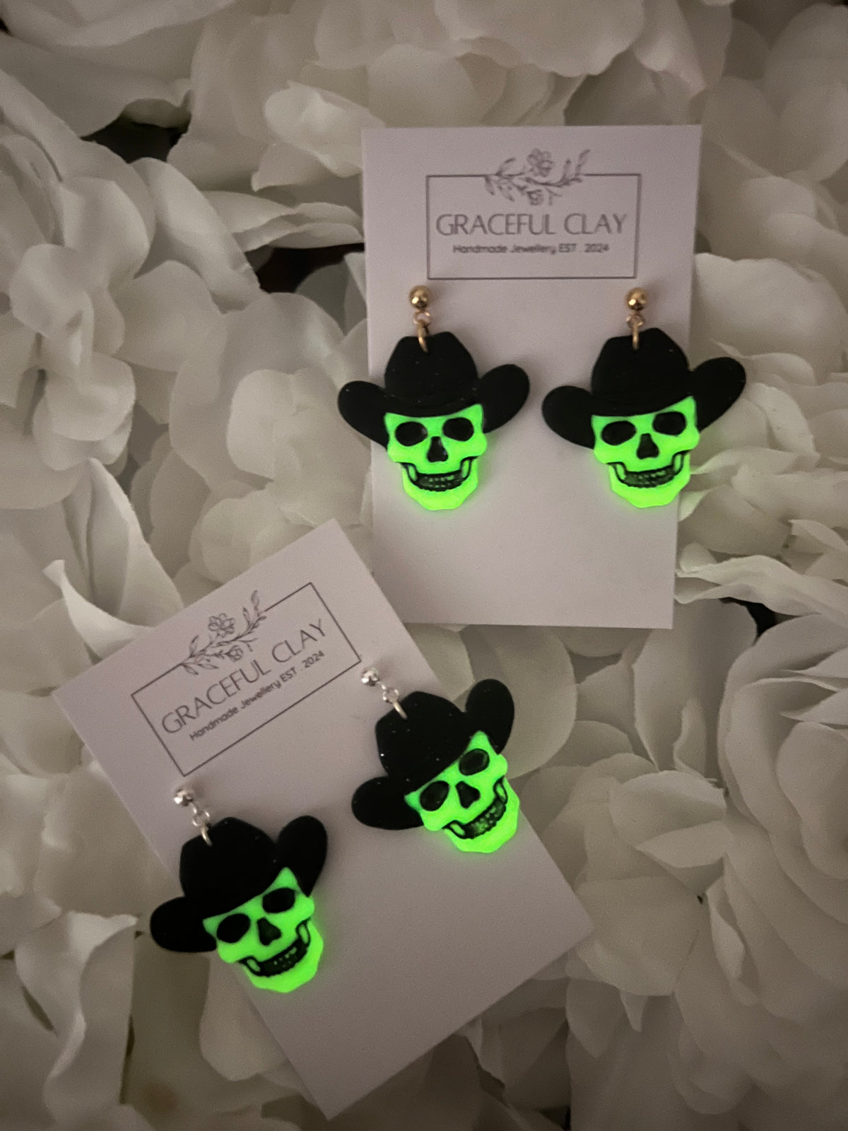 Glow in the dark skull cowboy earrings