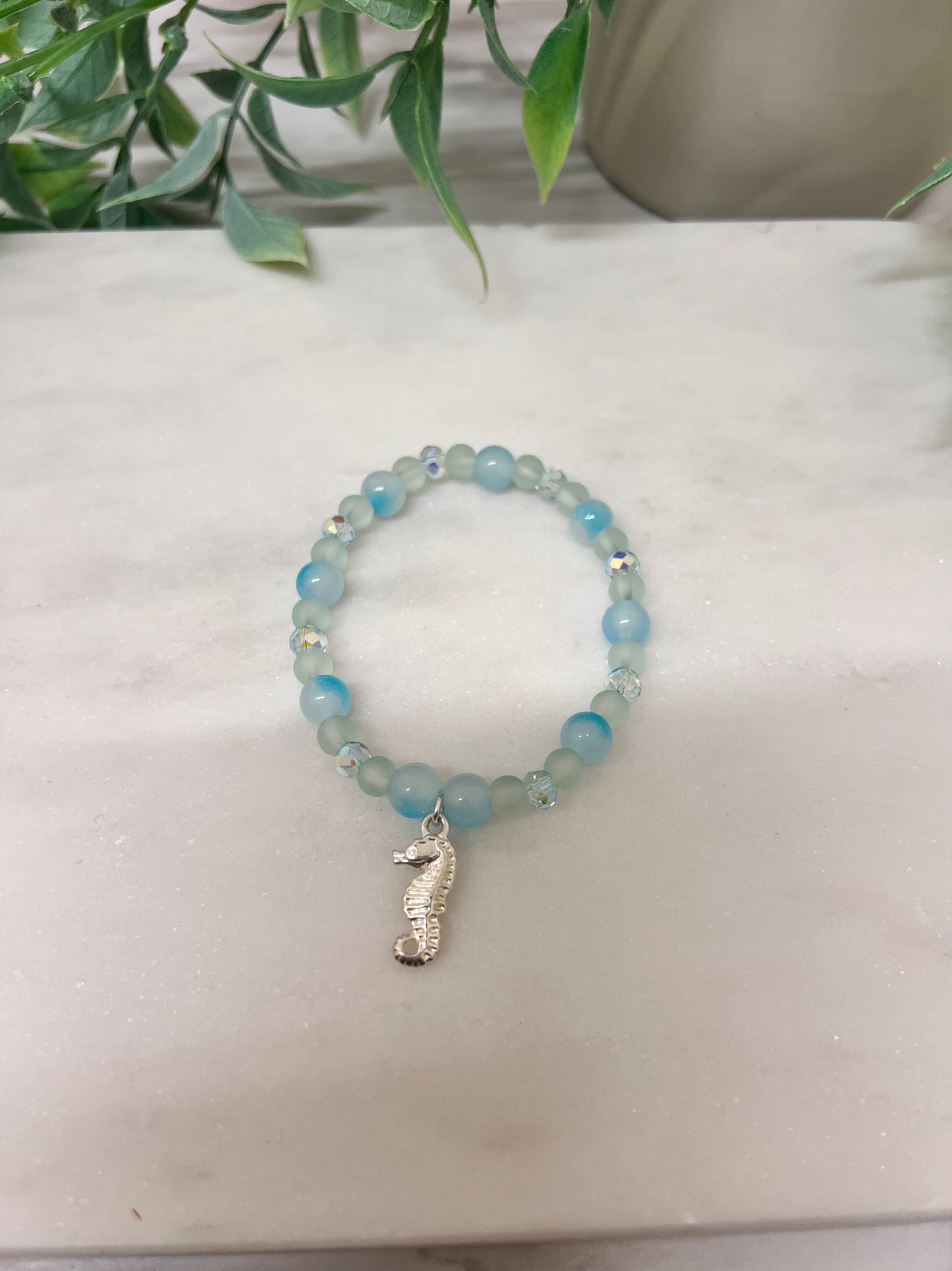Pastel blue stretch bracelet with Seahorse Charm