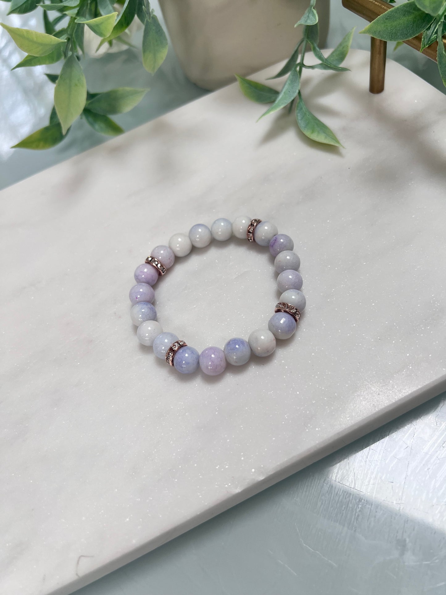Purple cracked glass beads & rose gold spacers stretch bracelet