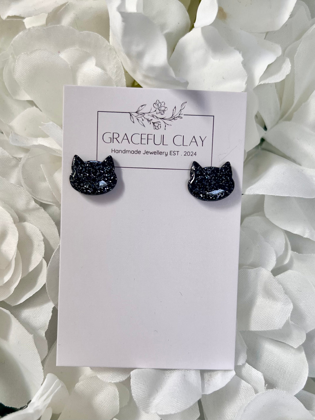 Black glitter cat studs