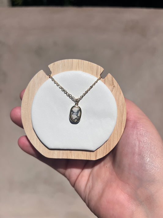 Small gold oval white marble necklace