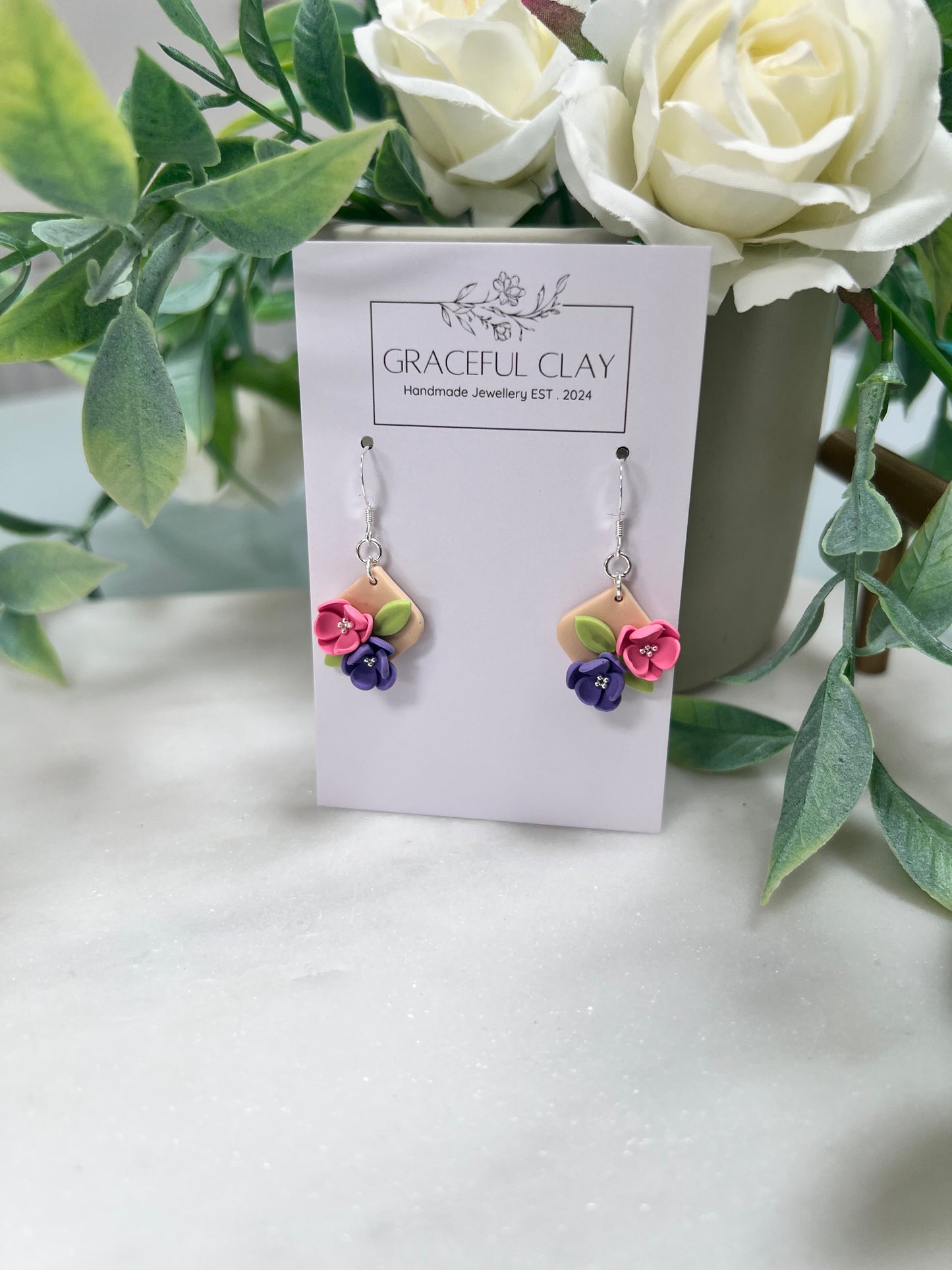 Small silver floral earrings
