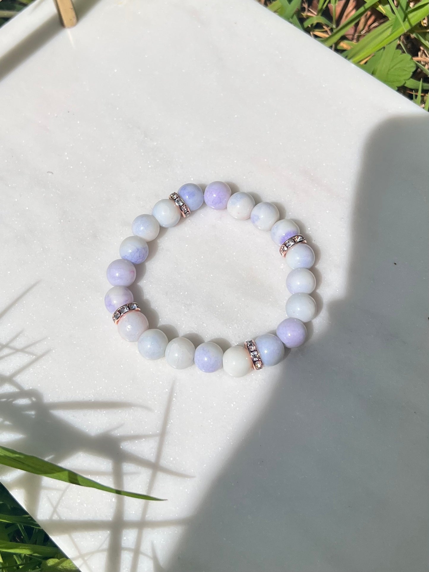 Purple cracked glass beads & rose gold spacers stretch bracelet
