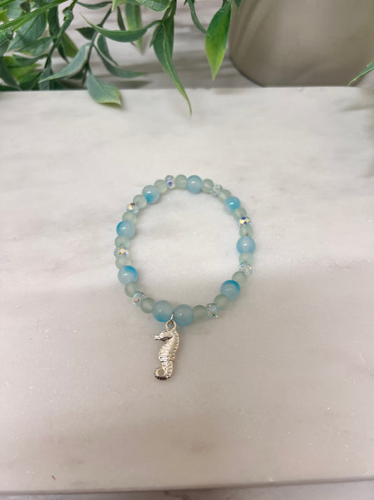 Pastel blue stretch bracelet with Seahorse Charm